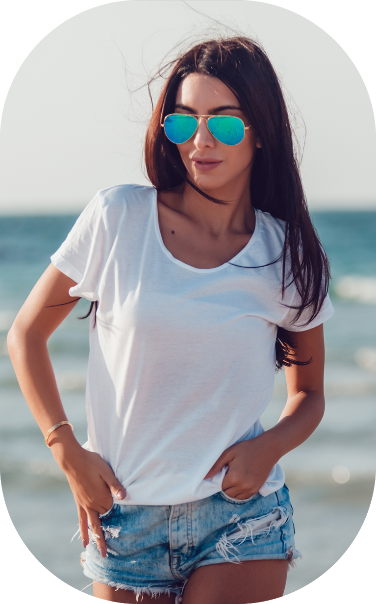 Girl in a white t-shirt on the background of the ocean. Mock-up.