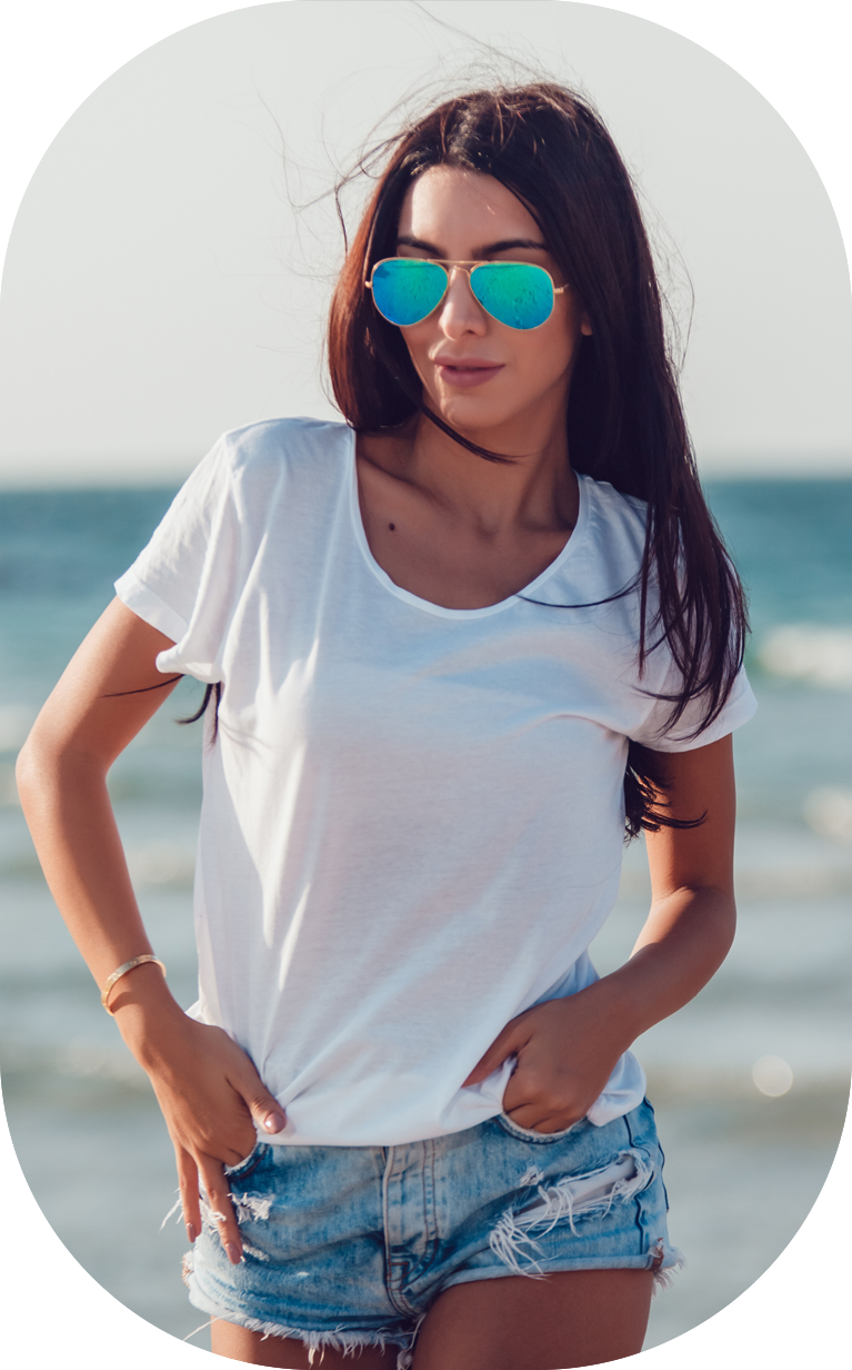 Girl in a white t-shirt on the background of the ocean. Mock-up.