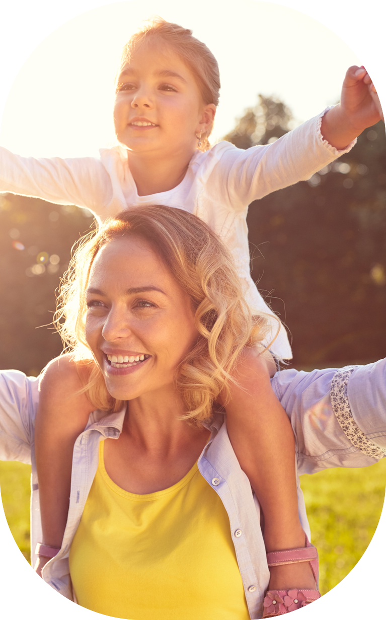 Mom and female child on her shoulders