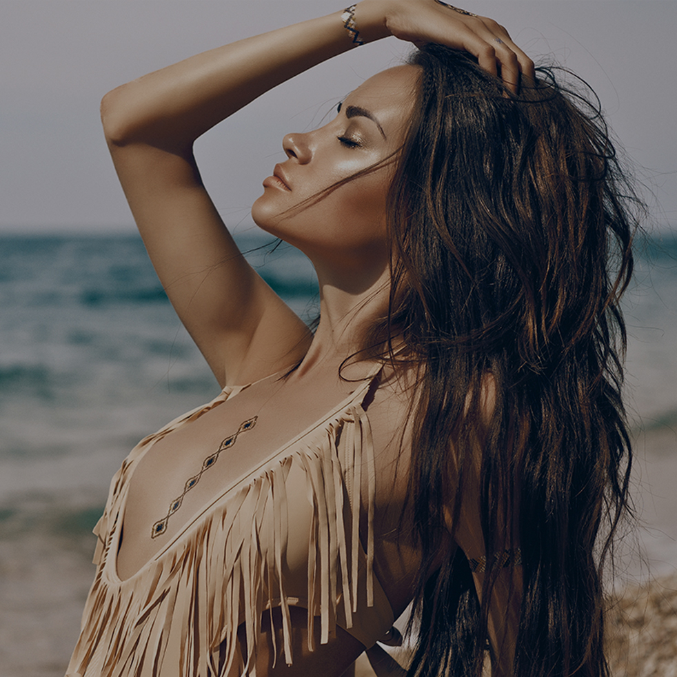 woman laying on beach gazing up into sky